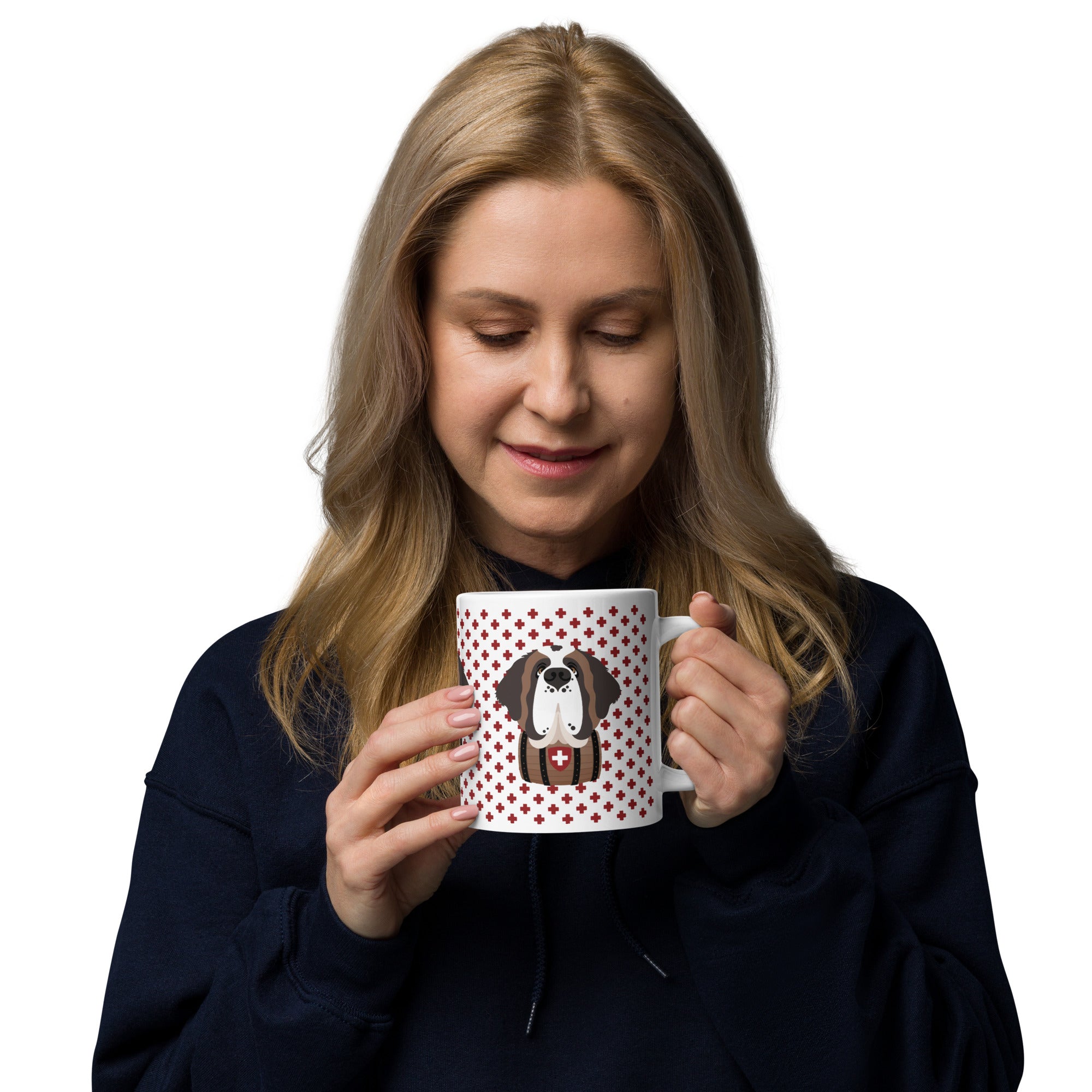 White ceramic 20 ounce mug featuring a cute illustrated Saint Bernard dog wearing a rescue barrel, surrounded by a red Swiss cross pattern. Perfect gift for St Bernard dog lovers and Swiss Alps fans by Lucy and Norman.