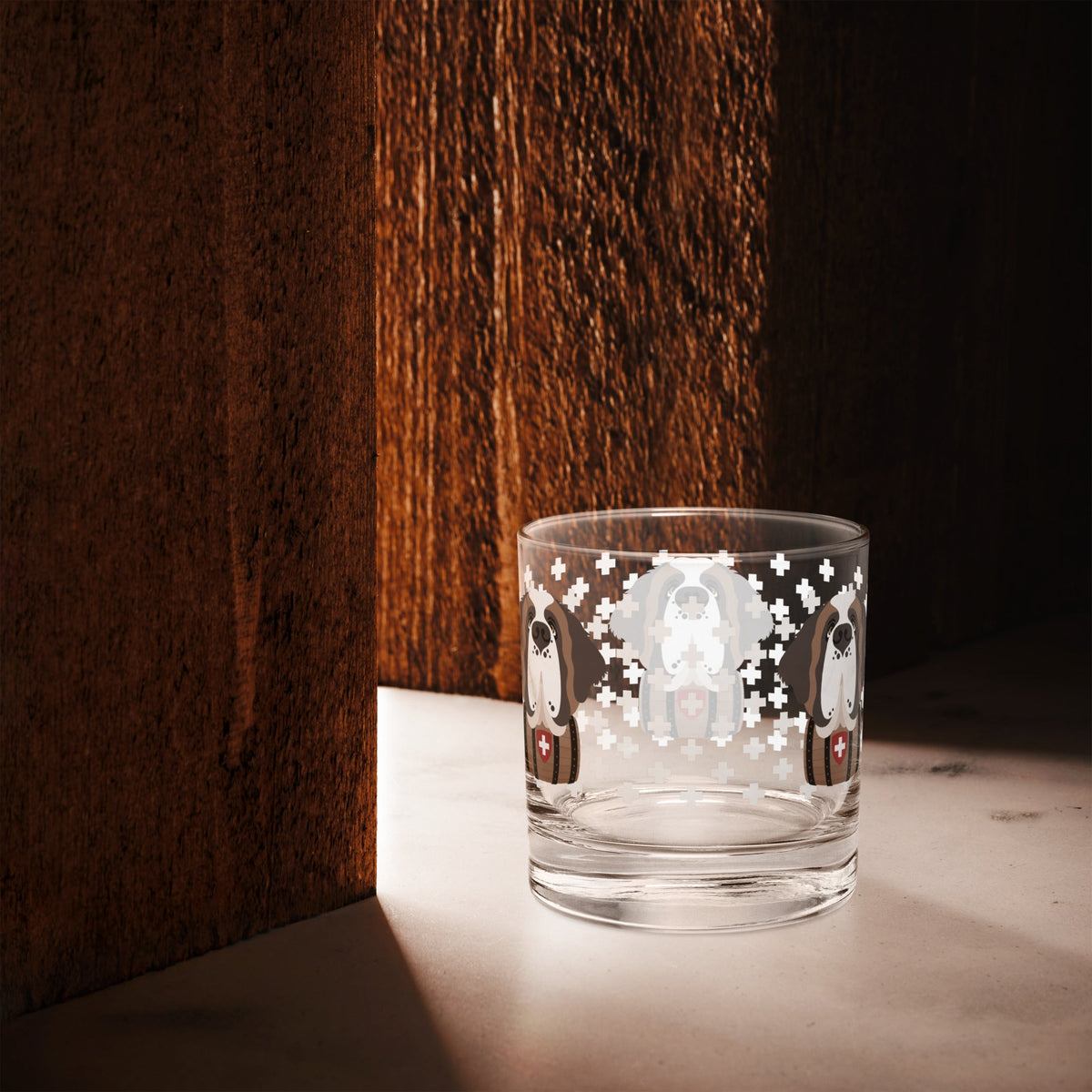 10.5 once rock glass drinkware with a modern pattern of Swiss inspired white crosses and a cute large Saint Bernard dog head with a barrel by Lucy and Norman