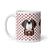 White ceramic 11 ounce mug featuring a cute illustrated Saint Bernard dog wearing a rescue barrel, surrounded by a red Swiss cross pattern. Perfect gift for St Bernard dog lovers and Swiss Alps fans by Lucy and Norman.