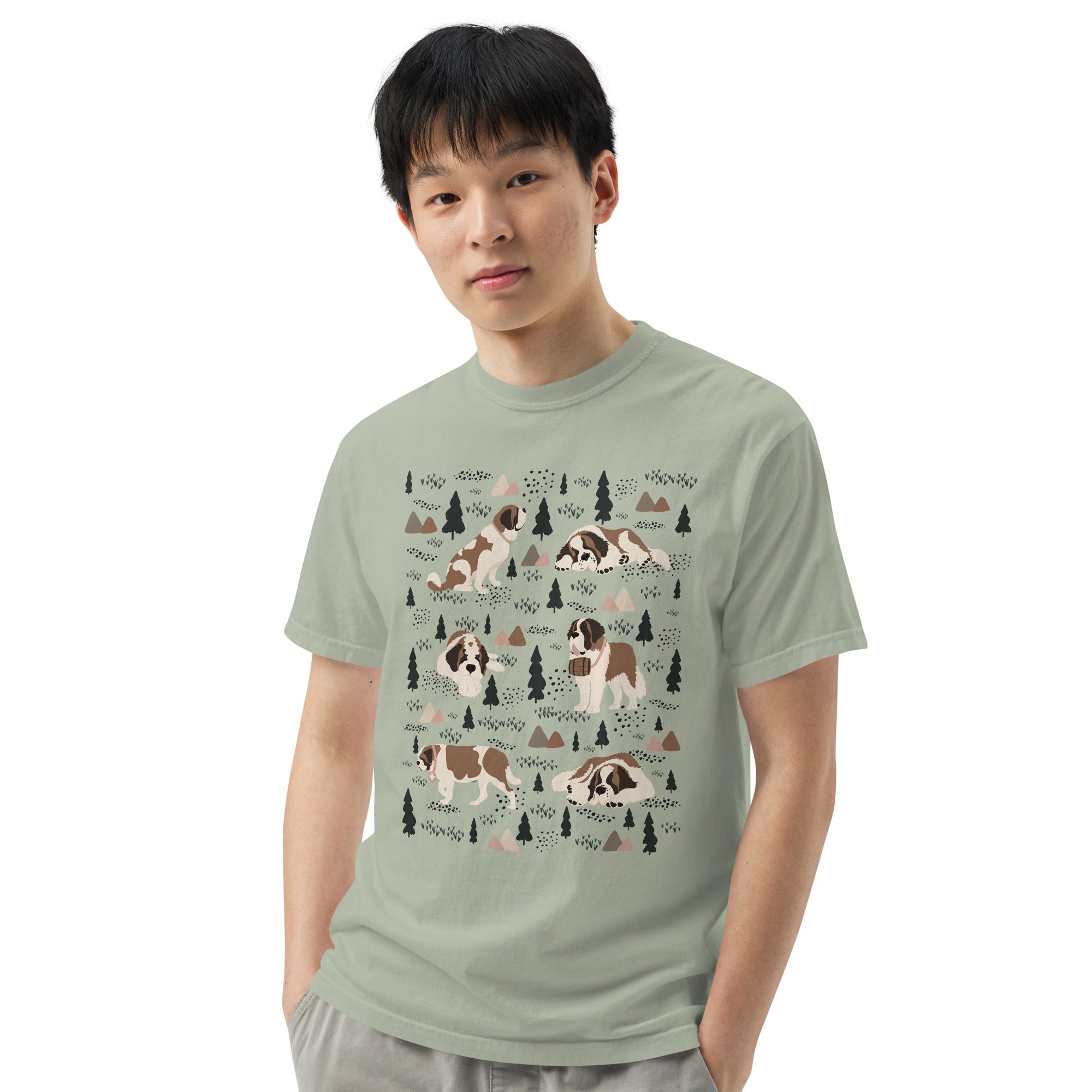 Comfort Colors bay green t-shirt featuring a woodland-themed Saint Bernard dog woodland and mountains pattern with six adorable Saint Bernards in various poses, perfect Saint Bernard gift for dog lovers.