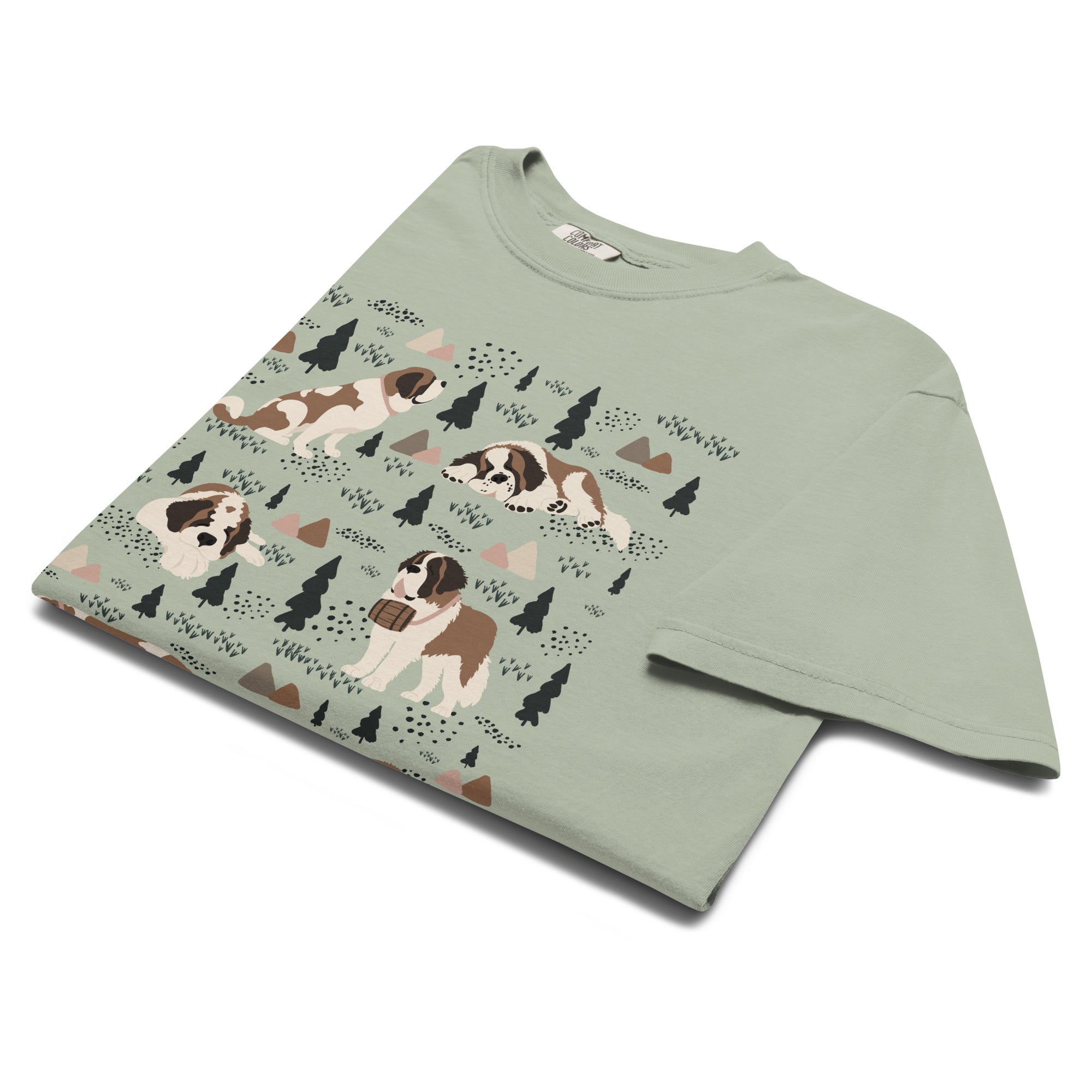 Comfort Colors bay green t-shirt featuring a woodland-themed Saint Bernard dog woodland and mountains pattern with six adorable Saint Bernards in various poses, perfect Saint Bernard gift for dog lovers.