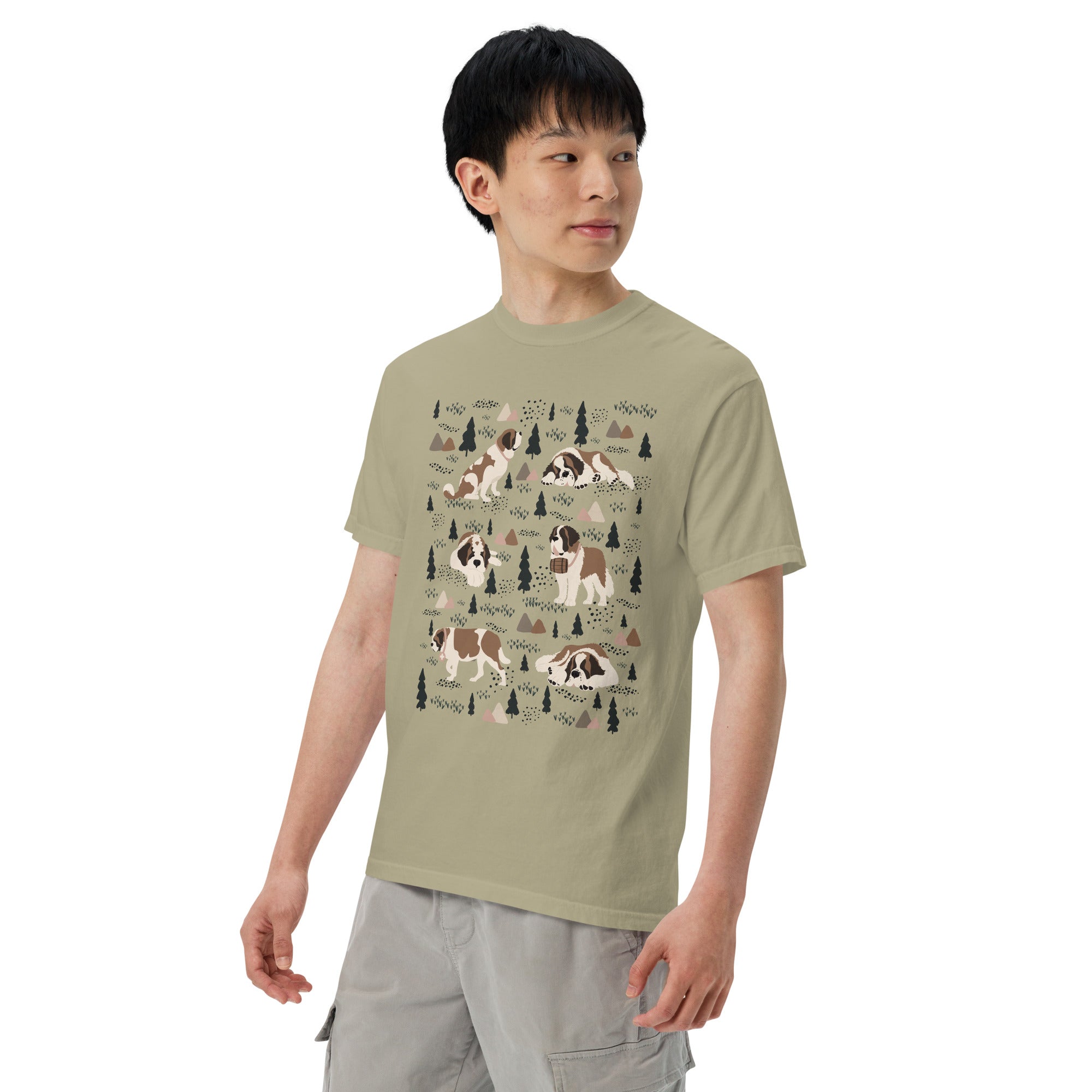 Comfort Colors Khaki t-shirt featuring a woodland-themed Saint Bernard dog woodland and mountains pattern with six adorable Saint Bernards in various poses, perfect Saint Bernard gift for dog lovers.