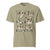 Comfort Colors Khaki t-shirt featuring a woodland-themed Saint Bernard dog woodland and mountains pattern with six adorable Saint Bernards in various poses, perfect Saint Bernard gift for dog lovers.